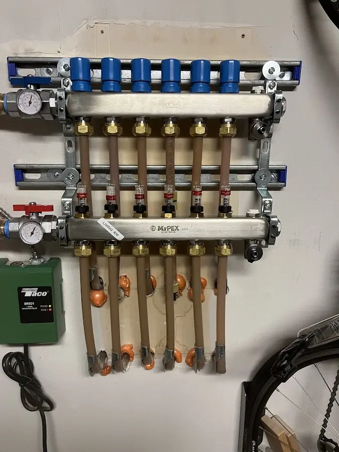 Plumber performing Water Heater Repair at a residential property in St. Charles